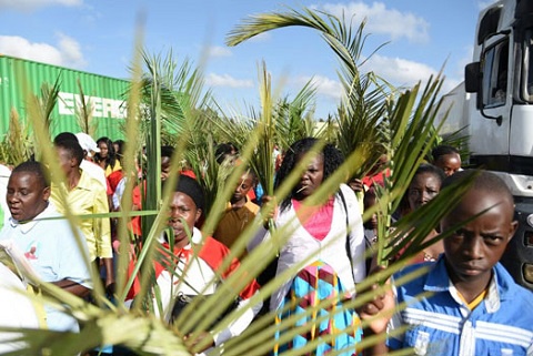 Church members parading with their palm fronds