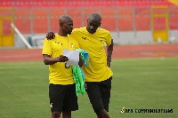 Black Stars interim coach, Otto Addo and his assistant George Boateng(holding the paper)