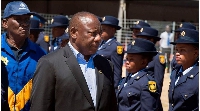 South-Africa's President Cyril Ramaphosa (R) and Police Minister Bheki Cele inspecting a guard of