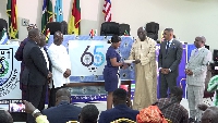 Board members during unveiling of anniversary logo