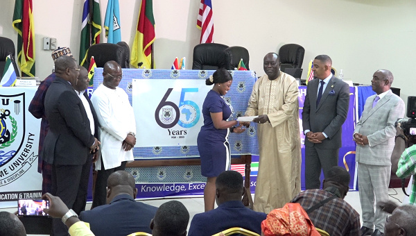 Board members during unveiling of anniversary logo