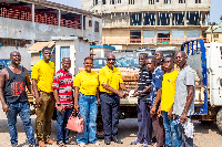 Representatives of the Trust, presenting the items to some of the beneficiaries