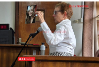 Ms Marije Slijkerman displays her daughter’s picture at the Buganda Road Chief Magistrate’s Court