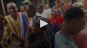 Wontumi (in white and yellow smoke) being mobbed by residents of Atwima Nwabiagya North