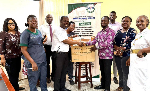 Workers at the Korle Bu Polyclinic (R) receiving a donation from the Drewgees Foundation (L)