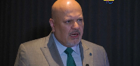 Karim Khan enters the court room for the trial of Mahamat Said Abdel Kani