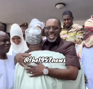 NAPO beaming with smiles whiles hugging Minister of Interior-designate, Mohammed-Mubarak Muntaka