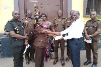 Dr Ernest Puni Kwarko in a shot with some Prison officials