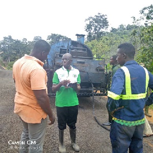 Samuel Adu-Gyamfi in chat with the contractors during the inspection