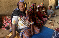 Displaced women from South Kordofan sit on the ground in El Obeid, North Kordofan state, Sudan