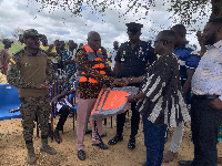 Bede Ziedeng (middle) making the presentation