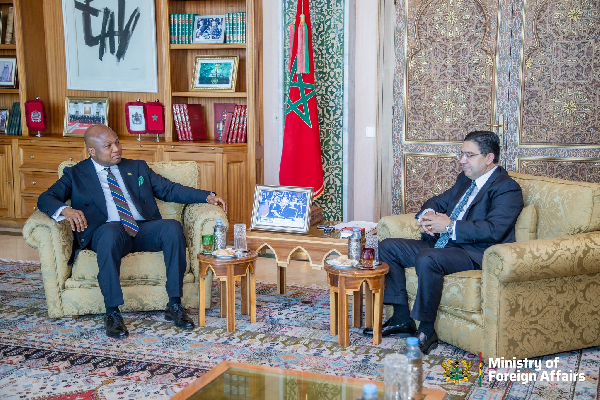 Samuel Okudzeto (L) in a meeting with Morocco’s Foreign Minister, Nasser Bourita