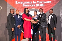Staff and executives of Comsys Ghana with the award