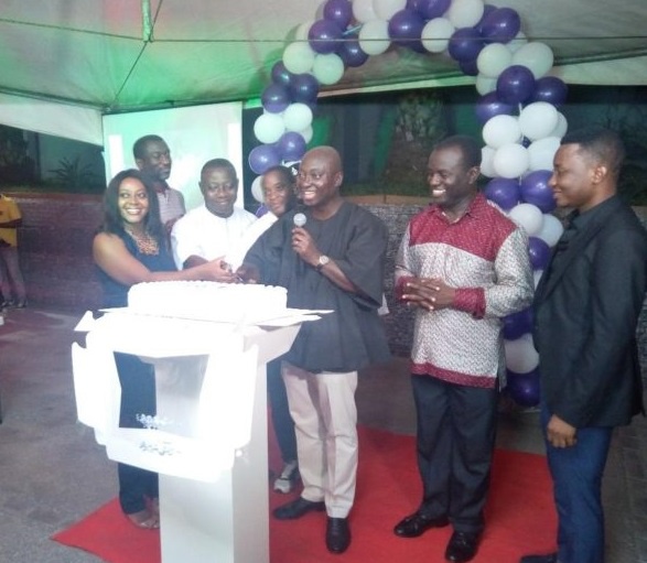 Mr. Atta Akyea, being assisted by officials of GAR and GHL Bank to launch the association