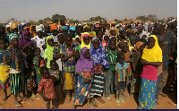 Displaced people wait for help at a village in Dablo area, Burkina Faso