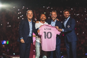 Lionel Messi (second from left) with officials of Inter Miami at the unveiling