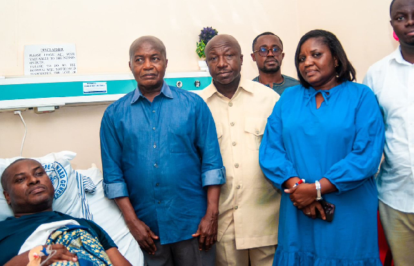 Richard Ahiagbah [L], Stephen Ntim and others during the visit