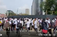 Screenshot showing a scene from the protest