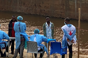 Passengers from intercepted boat await testing in Kinshasa