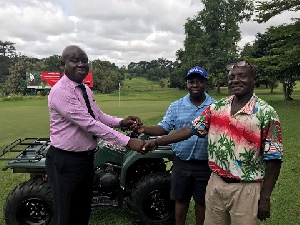 Mr. Mensah-Oppong handing over the keys to Prof. Baiden and Mr. Suglo.