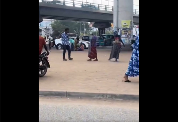 The young man in a stand off with one of the beggars