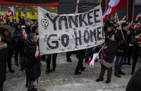 People attend a protest against President Trump’s demand that the Arctic island be ceded to the US
