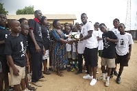Afriyie Acquah making a presentation to the school authorities