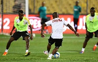 Majeed Waris kicks the ball as Boye tries to win it back (Credit: Senyuiedzorm Awusi Adadevoh)