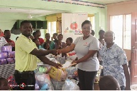 Baisiwa Dowuona-Hammond making the donation
