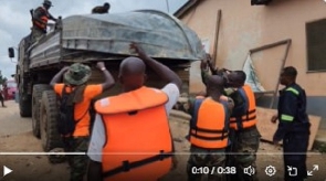 Personnel of the Ghana Armed Forces loading one of thier boat onto a truck