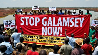 #StopGalamseyNow banner being held by protesters