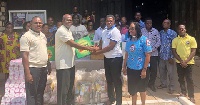 Dr Kwaku Ganu, Chairman of the planning committee, presenting the items to Mr Frank Ampeh