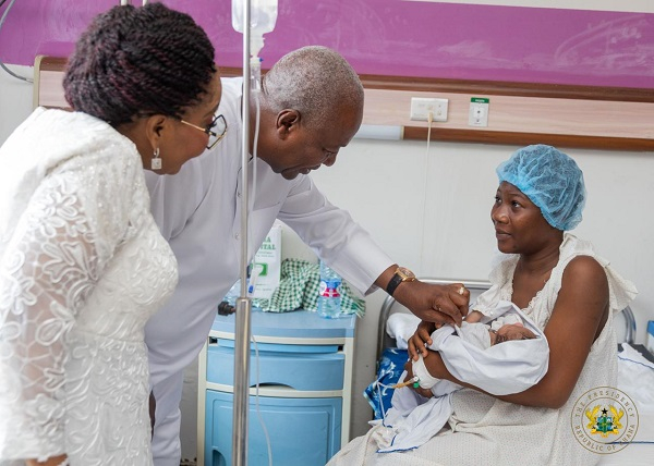 President John Dramani Mahama and Lordina Mahama speaking to a patient at the hospital