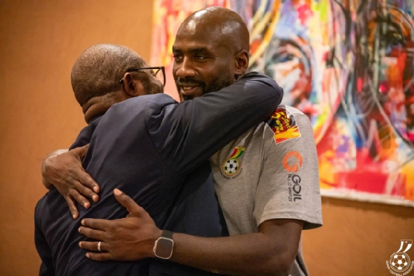 A photo of GFA president Kurt Okraku embracing Black Stars coach Otto Addo