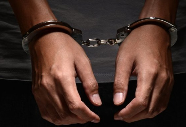 File photo of a suspect in handcuffs