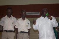 Chief of Staff, Julius Debrah with the two students