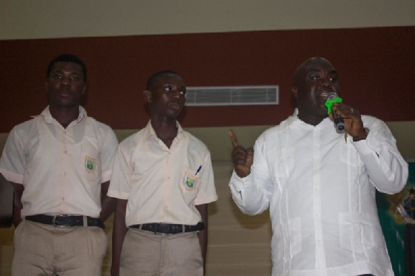 Chief of Staff, Julius Debrah with the two students