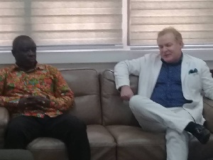 Nick Holland interacting with sector Minister, Kwaku Asomah-Cheremeh