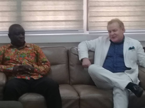 Nick Holland interacting with sector Minister, Kwaku Asomah-Cheremeh