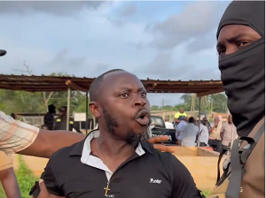 The pastor (in a black shirt) during the altercation