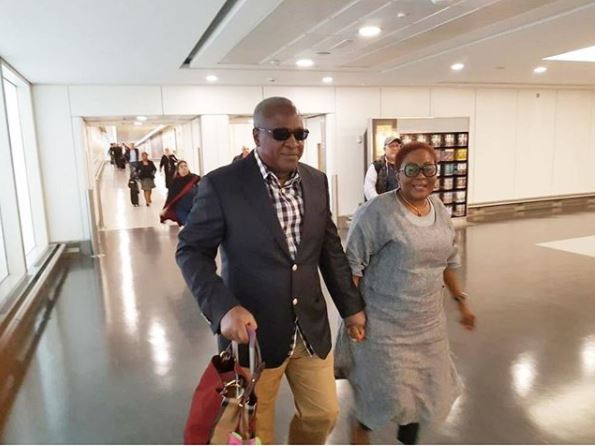 Former President John Dramani Mahama carrying his wife's bag