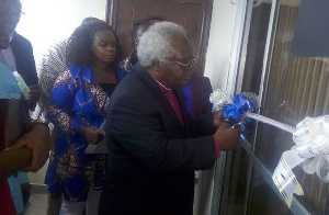 Most Rev. Prof. Emmanuel Martey cutting the tape to commission the hospital