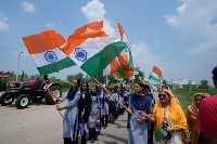 School children holding Indian flags ahead of the country's Independence Day