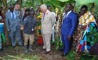 Prince Charles inspecting a cocoa farm at Kona