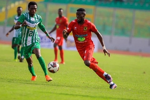 Asante Kotoko's George Mfegue in action against King Faisal