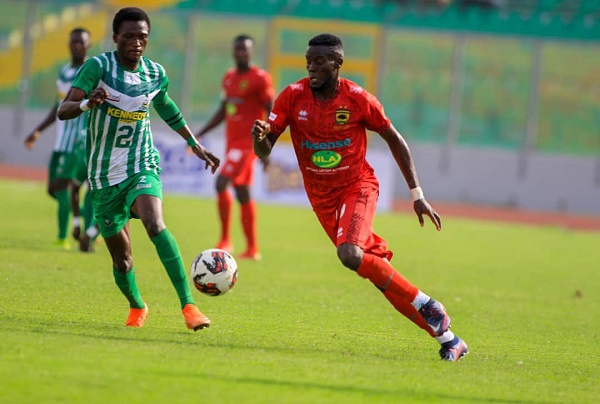 Asante Kotoko's George Mfegue in action against King Faisal