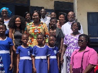 Rosemond Brown in a group photo with pupils and teachers of Suhum Anglican School