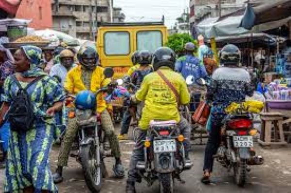 A motorcycle taxi at a market in Cotonou, Benin