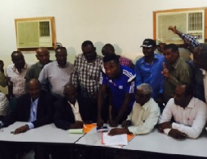 Abeiku Ainooson signing the contractual documents in Sudan