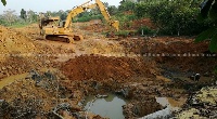 An excavator working at a mining site